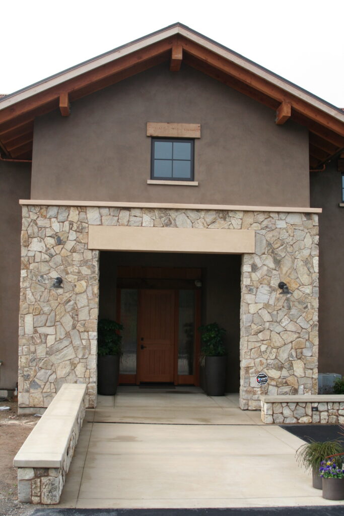 cut stone veneer lines the garden planters and entrance to a Sonoma County winery