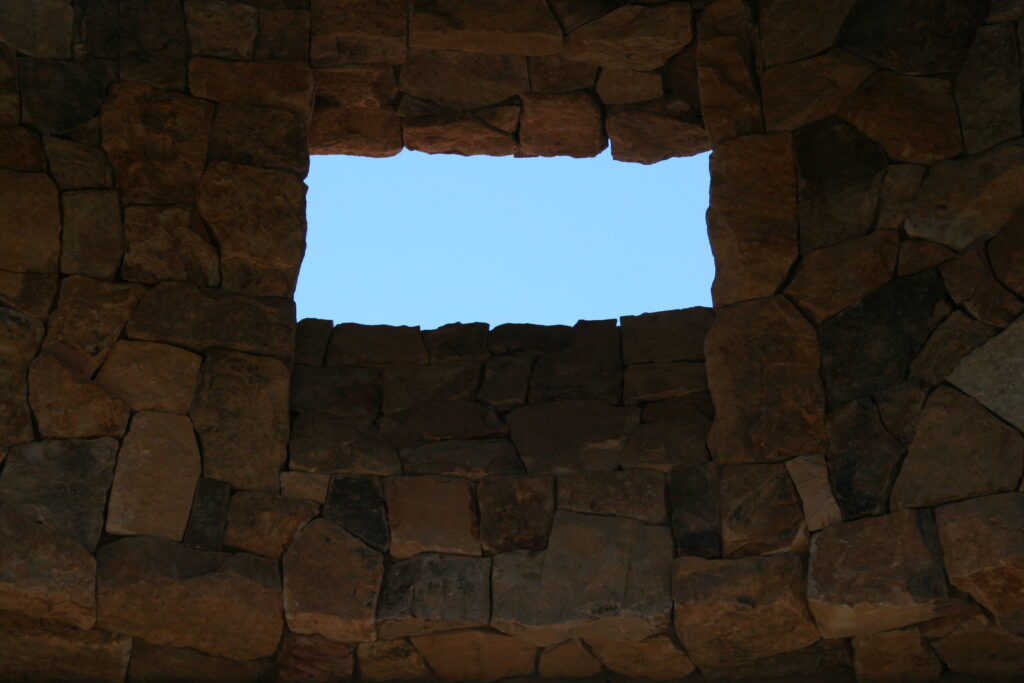 a view of the inside of the rotunda of the Santa Rosa estate; both the inside and outside of the building have cut stone veneer; the windows do not yet have glass panes