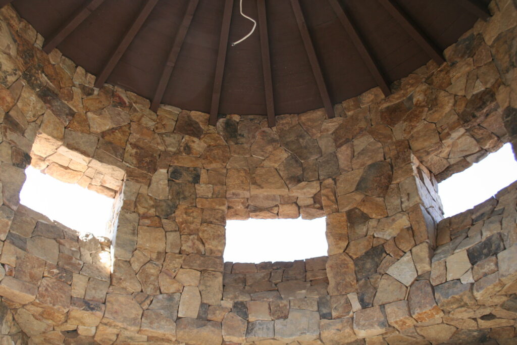 a view of the inside of the rotunda of the Santa Rosa estate; both the inside and outside of the building have cut stone veneer; the windows do not yet have glass panes