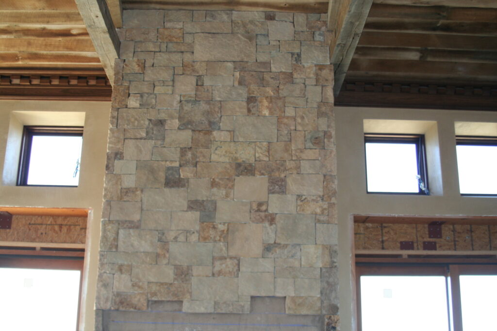 closeup of cut stone veneer for the residence's interior; the stones are cut very regularly so they sit in a square or rectangular pattern