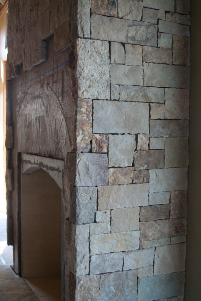 closeup of cut stone veneer for the residence's interior; the stones are cut very regularly so they sit in a square or rectangular pattern