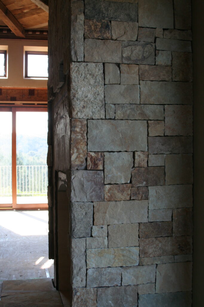 closeup of cut stone veneer for the residence's interior; the stones are cut very regularly so they sit in a square or rectangular pattern