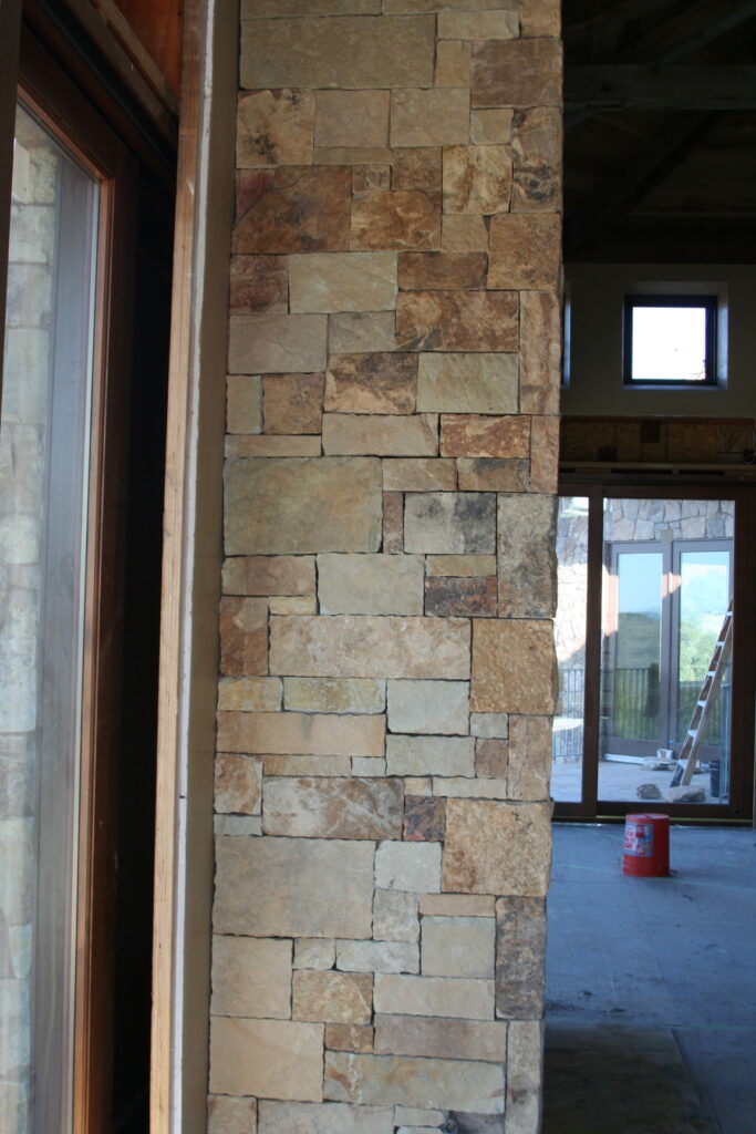 closeup of cut stone veneer for the residence's interior; the stones are cut very regularly so they sit in a square or rectangular pattern