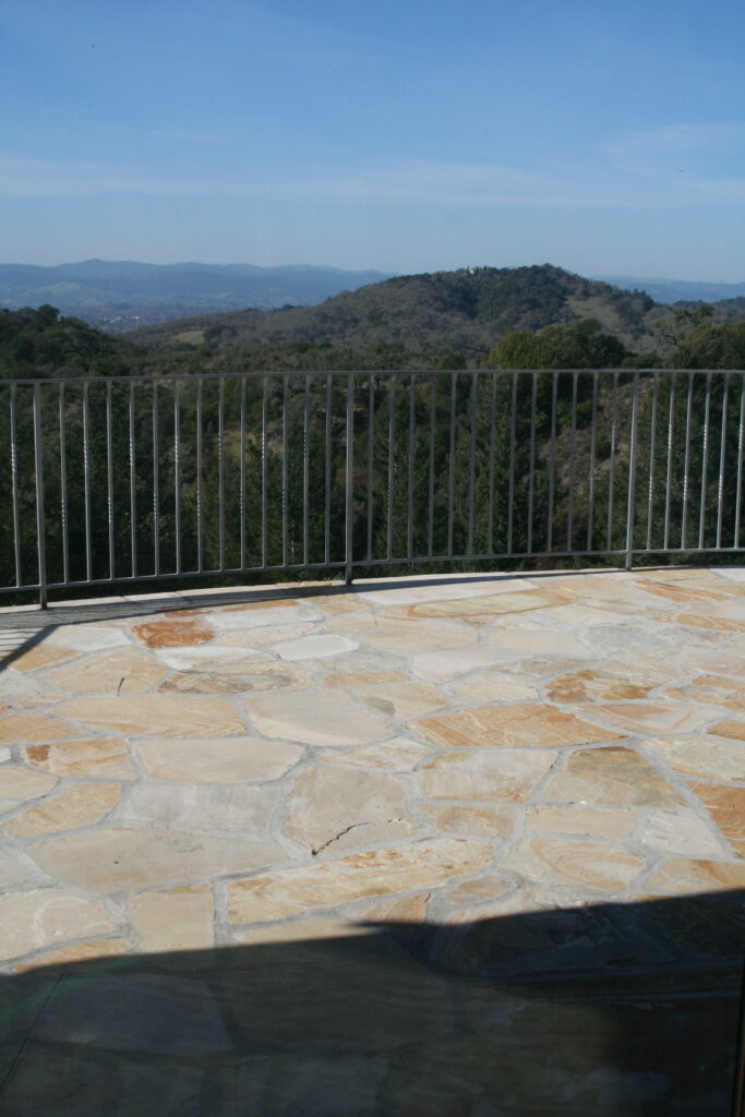 view from the second story balcony of the Santa Rosa residence up in the hills; the balcony is surrounded by wrought iron rails