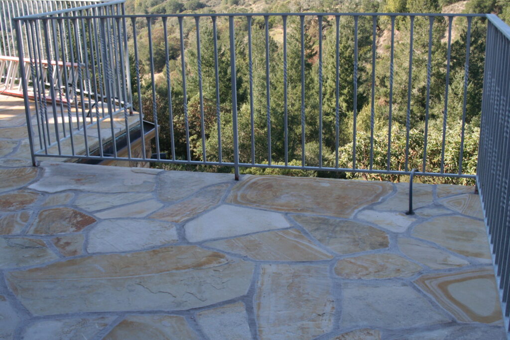 view from the second story balcony of the Santa Rosa residence up in the hills; the balcony is surrounded by wrought iron rails