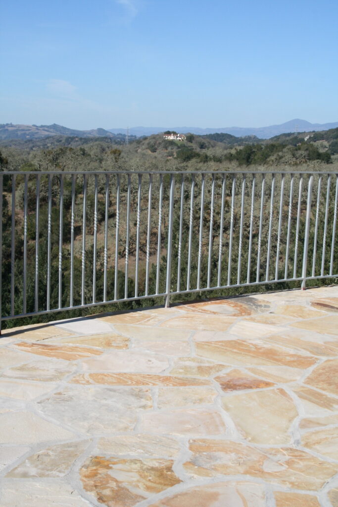 view from the second story balcony of the Santa Rosa residence up in the hills; the balcony is surrounded by wrought iron rails