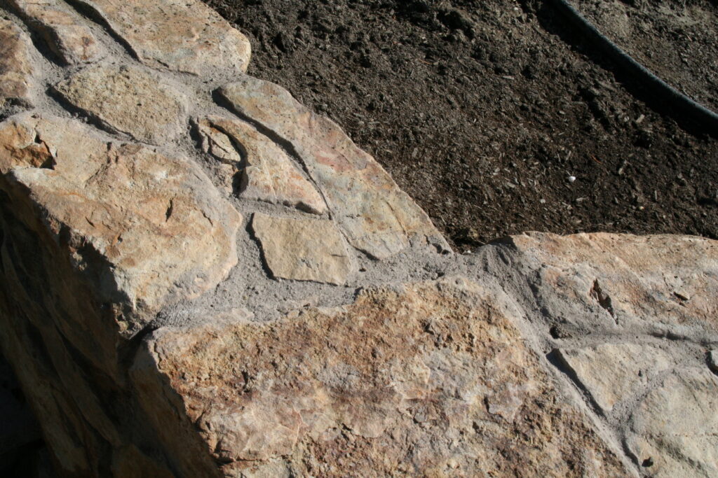 close up of a cut stone garden planter