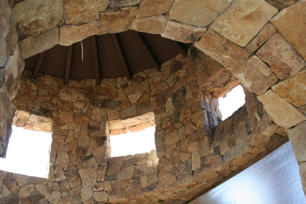 a view of the inside of the rotunda of the Santa Rosa estate; both the inside and outside of the building have cut stone veneer; the windows do not yet have glass panes