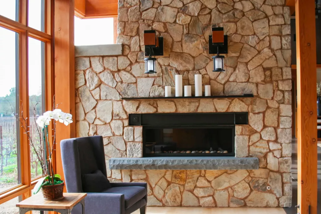 indoor stone fireplace with mantel
